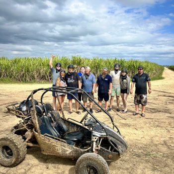 Travelers standing next to their buggies in the Dominican backcountry on a guided off-road adventure
