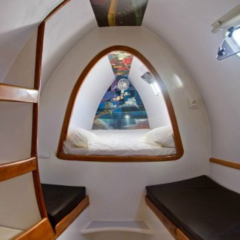 Interior view of the Quetzal catamaran lounge with a large window facing the sea