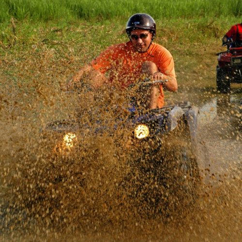 Man splashing through mud on a powerful buggy – adrenaline-filled adventure near Bayahibe