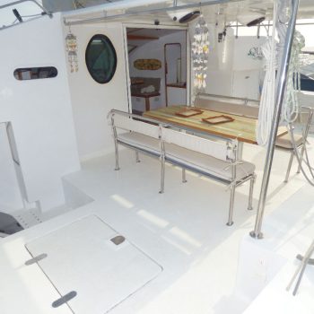 Fully equipped galley kitchen with counter and stainless steel sink on board